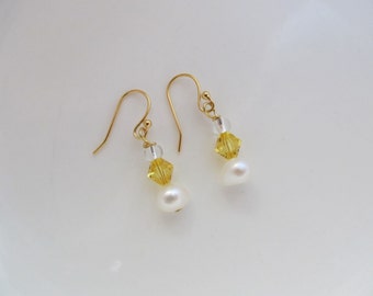 Gold plated earrings with white freshwater pearl & yellow Swarovski crystal