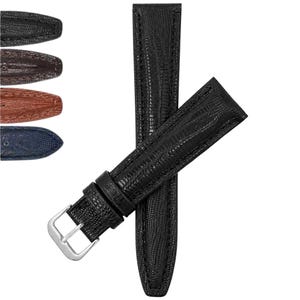 May include: A black watch strap with a textured lizard-skin pattern and matching black stitching. The strap features a silver-toned metal buckle and a sliding loop. Additional color options in black, brown, tan, and blue are shown on the left.