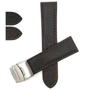 May include: Dark brown leather watch strap with red stitching and a silver clasp. The strap is made of textured leather and has a classic design. The watch band is a replacement part for a watch.