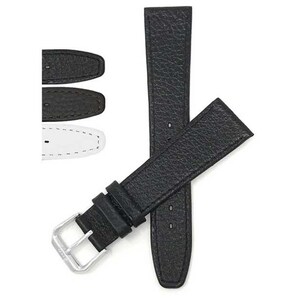 May include: Black leather watch strap with a silver buckle. The strap has a textured surface and is shown with two other watch strap ends in black and brown, and one in white.