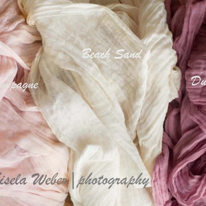 May include: Three fabric swatches in different colors: pink champagne, beach sand, and dusty rose. The fabric is sheer and has a crinkled texture. The text "Gisela Weber | photography" is visible in the bottom center of the image.