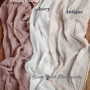 May include: Three pieces of fabric in different shades of beige. The fabric is sheer and has a wrinkled texture. The fabric is labeled "Vintage Taupe", "Ivory", and "Antique".