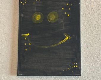 Minimalistyczny obraz uśmiechniętej buźki – nowoczesna sztuka ścienna na czarnym płótnie