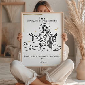 Peut inclure: Une affiche encadrée avec un dessin au trait de Jésus, les bras tendus, et le texte "Je suis le chemin, la vérité et la vie." Le texte "Personne ne vient au Père que par moi" est également présent. L'œuvre est en noir et or.
