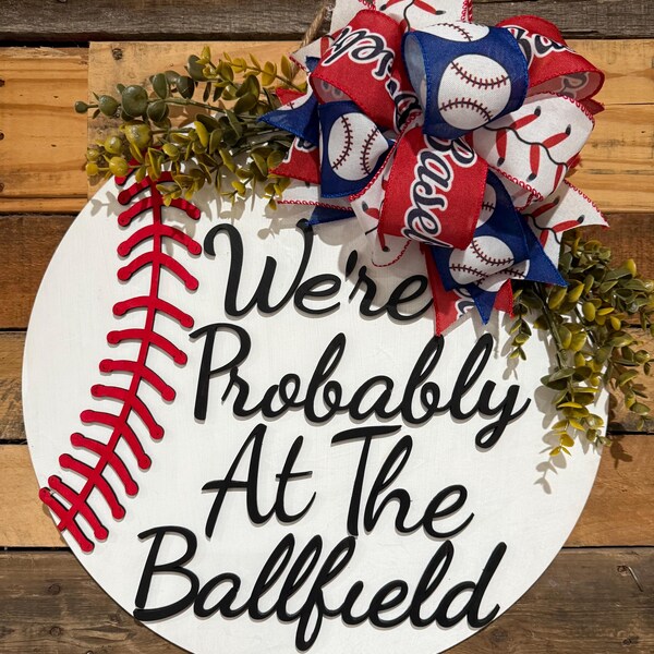 Baseball wooden door hanger. We’re probably at the ballfield!
