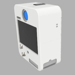 May include: A white photo booth with a black screen and a blue lens. The words "Just Smile" are written on the front. The photo booth has a rectangular shape with rounded edges.