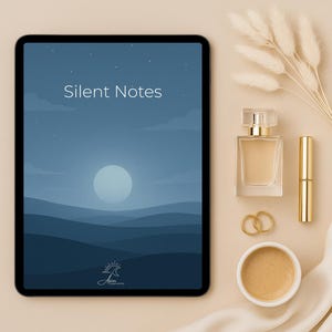 May include: A flat lay composition with a tablet showing "Silent Notes" against a blue landscape. Beside it are a perfume bottle, lipstick, two gold rings, and a small cup of coffee, arranged on a beige surface. The scene is aesthetically pleasing.