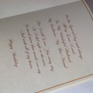 May include: A card with a gold border and a handwritten message that reads: "On this special day and always. All my love I send. To my wonderful husband, my soulmate, my best friend. For I still love you every day as I did right at the start. So much more than words can say and with all of my heart. Happy Birthday."
