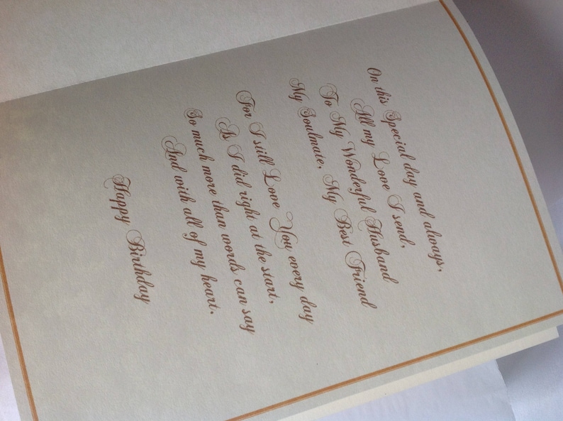 May include: A card with a gold border and a handwritten message that reads: "On this special day and always. All my love I send. To my wonderful husband, my soulmate, my best friend. For I still love you every day as I did right at the start. So much more than words can say and with all of my heart. Happy Birthday."
