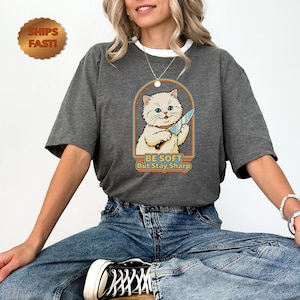 Be Soft But Stay Sharp Cat holding Knife T-Shirt | Cute Retro Kitten Tee