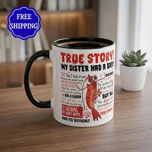 May include: A white ceramic mug with a black handle and rim, featuring a red cartoon shrimp illustration and black and red text that reads: TRUE STORY! MY SISTER HAD A BABY And I took it over And then she passed away AND THEN THE BABY LOST ALL ITS LEGS And it's arms And now it's nothing BUT A STUMP But i still take care Of it with my wife and ITS GROWING FAIRLY HAPPY... AND ITS DIFFICULT BECAUSE The second shift I've been working At the factory To put food on the table BUT ALL THE LOVE that I see in that little guy's face Makes it worth it to me TRUE STORY!