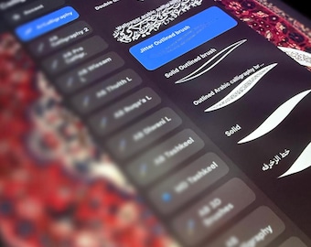 May include: Close-up of a digital tablet screen displaying calligraphy tools. The screen shows a list of brush options, including "Jitter Outlined brush" and "Solid Outlined brush". The interface is dark with white text and blue highlights.