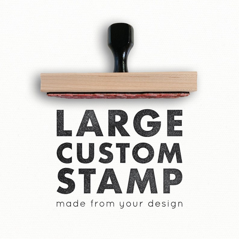 May include: A wooden custom stamp with a black handle. The stamp reads "LARGE CUSTOM STAMP made from your design".