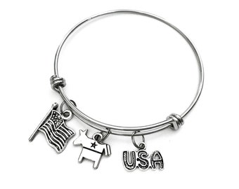 Democrat themed bracelet. Includes Democrat Donkey Symbol, American Flag, and USA with Stars Charms. Liberal Democratic gift.