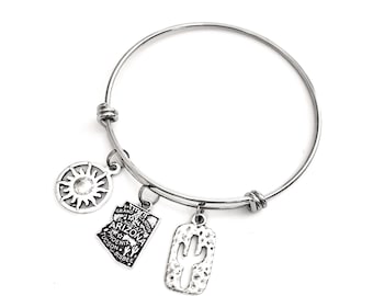 Arizona themed charm bracelet. Includes State of Arizona, Cactus, & tribal sun. Phoenix, Tucson, Scottsdale, Grand Canyon Costume Jewelry.