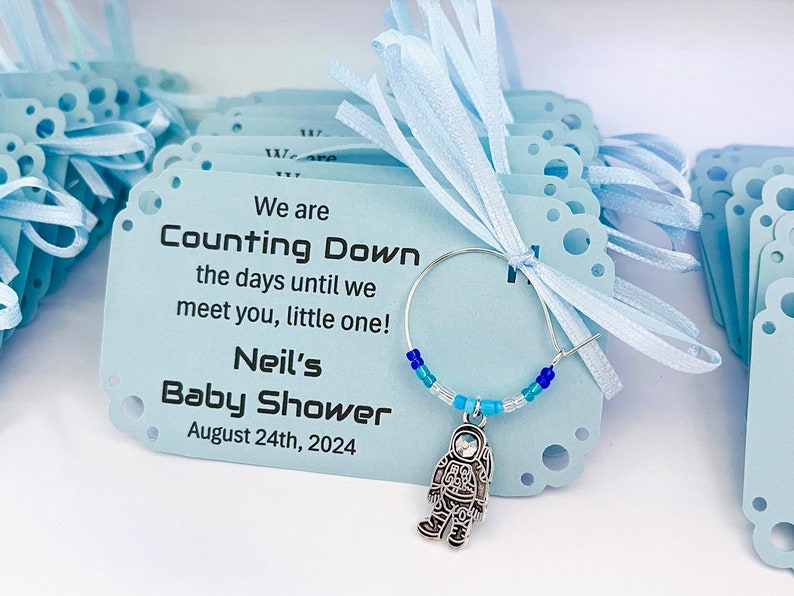 Astronaut charm on wine ring with baby shower favor