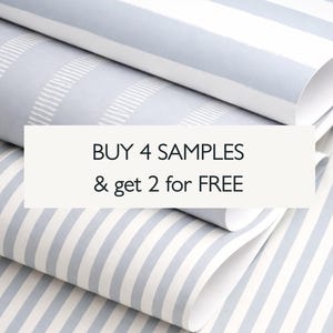 May include: Stacked rolls of wallpaper featuring light blue and white striped patterns, including both wide and thin vertical lines. A white rectangular overlay in the center displays the black text: BUY 4 SAMPLES & get 2 for FREE.