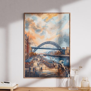 Può includere: Un dipinto ad acquerello incorniciato raffigura un ponte su un fiume con persone che camminano lungo il lungofiume. Il cielo è un misto di arancione, blu e grigio. Il ponte è un arco blu scuro. Il dipinto è esposto su un mobile in legno chiaro.