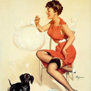 May include: A woman in a red dress blows bubbles with a pipe while sitting on a chair. A black dachshund sits in front of her, looking up at the bubbles. There is a bowl of soap suds on the floor.