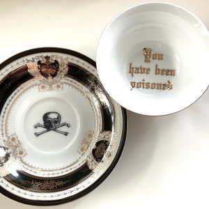 Porcelain "You have been poisoned" cup and saucer set. 22k gold, food safe.