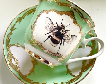 Hermoso juego de taza de té y platillo de abeja, 8 oz. Apto para alimentos y lavavajillas. China de hueso vegana.