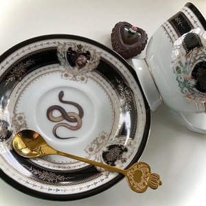 Porcelain Snake cup and saucer set or Plate. Food Safe and Durable, Porcelain. Holds 8 ounces.