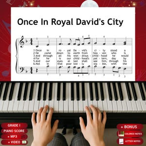 May include: A sheet music page titled Once In Royal David's City featuring musical notation and lyrics for six verses, positioned above a piano keyboard. The score includes treble and bass clefs with numbered fingerings for playing the melody.