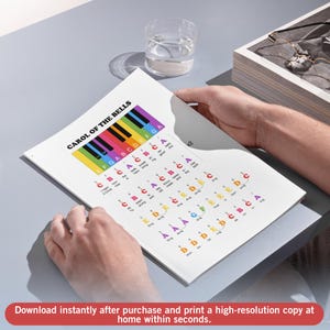 May include: A sheet music printout of "Carol of the Bells" with a colorful piano keyboard graphic at the top. The text includes musical notes and lyrics. The bottom of the image has the text: "Download instantly after purchase and print a high-resolution copy at home within seconds."