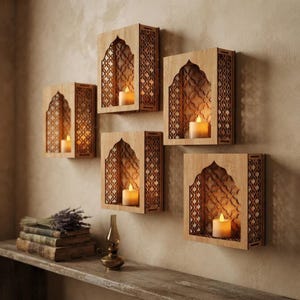 May include: Five rectangular light-colored wooden wall shelves with arched cutouts and intricate geometric lattice patterns on the sides and back. Each shelf contains a single white pillar candle emitting a warm, soft glow against the wall.