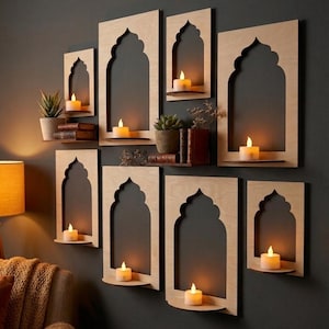 May include: A collection of wooden wall shelves with an arched design, each holding a small candle. Some shelves also display small potted plants and books. The shelves are mounted on a dark gray wall, creating a warm, inviting ambiance.