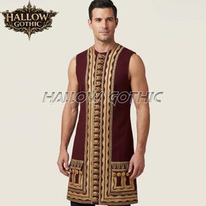 May include: A sleeveless, knee-length burgundy tunic featuring a central vertical panel with gold embroidery and a row of gold buttons. The garment includes two front pockets with gold trim and tassels. The text HALLOW GOTHIC is visible.
