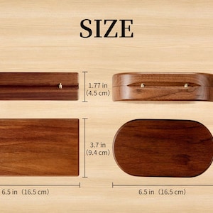 K&ouml;nnte beinhalten: Das Bild zeigt vier Holzboxen in verschiedenen Formen, darunter rechteckige und ovale Designs. Die Abmessungen sind in Zoll und Zentimetern angegeben: 6,5 Zoll (16,5 cm) lang, 3,7 Zoll (9,4 cm) breit und 1,77 Zoll (4,5 cm) hoch.