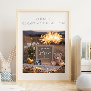 May include: A framed print with the text "OUR BABY WE CAN'T WAIT TO MEET YOU." The image inside shows a "Surprise" announcement with a teddy bear, ultrasound photo, and flowers. The announcement is for October 2023.