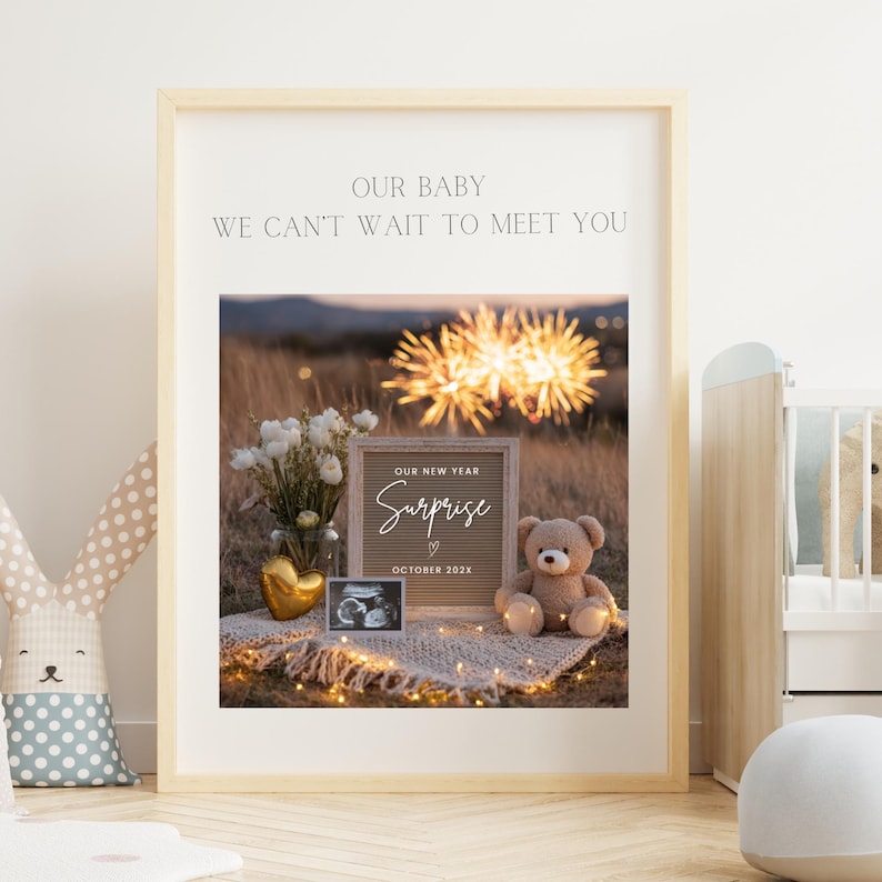 May include: A framed print with the text "OUR BABY WE CAN'T WAIT TO MEET YOU." The image inside shows a "Surprise" announcement with a teddy bear, ultrasound photo, and flowers. The announcement is for October 2023.