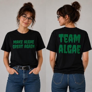 May include: A black short-sleeved t-shirt featuring green text. The front displays the words "MAKE ALGAE GREAT AGAIN" in a dripping font style. The back of the shirt features the words "TEAM ALGAE" in the same green dripping font style.