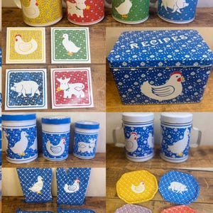 May include: A collection of kitchenware with farm animal designs. Includes mugs, coasters, a recipe box, pot holders, and jar-shaped containers. The items feature images of a chicken, cow, duck, and pig on a variety of backgrounds.