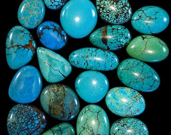 Set of 20 natural turquoise cabochons largest about 1 inch.