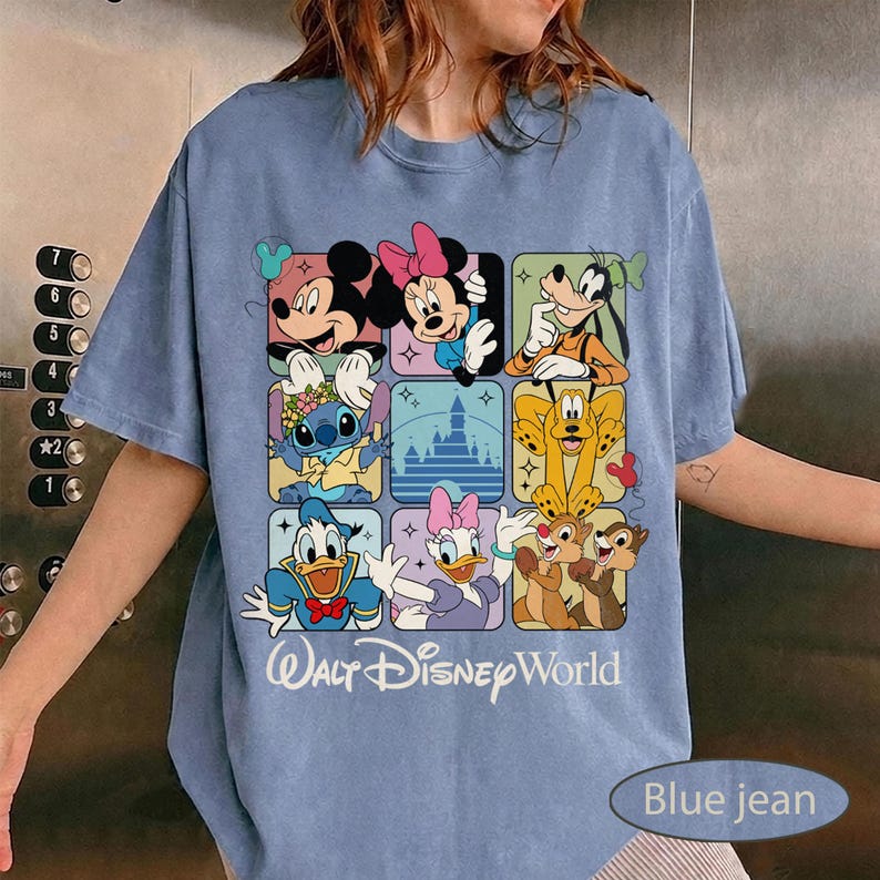 May include: Blue jean-colored t-shirt featuring a grid of Disney characters including Mickey Mouse, Minnie Mouse, Goofy, Stitch, Donald Duck, Daisy Duck, Chip and Dale. The words "Walt Disney World" are printed below the grid.