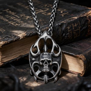 May include: A set of three ceramic mugs with a speckled, matte finish. The mugs are in shades of cream, light gray, and dark gray. Each mug has a simple, minimalist design and a rounded handle.