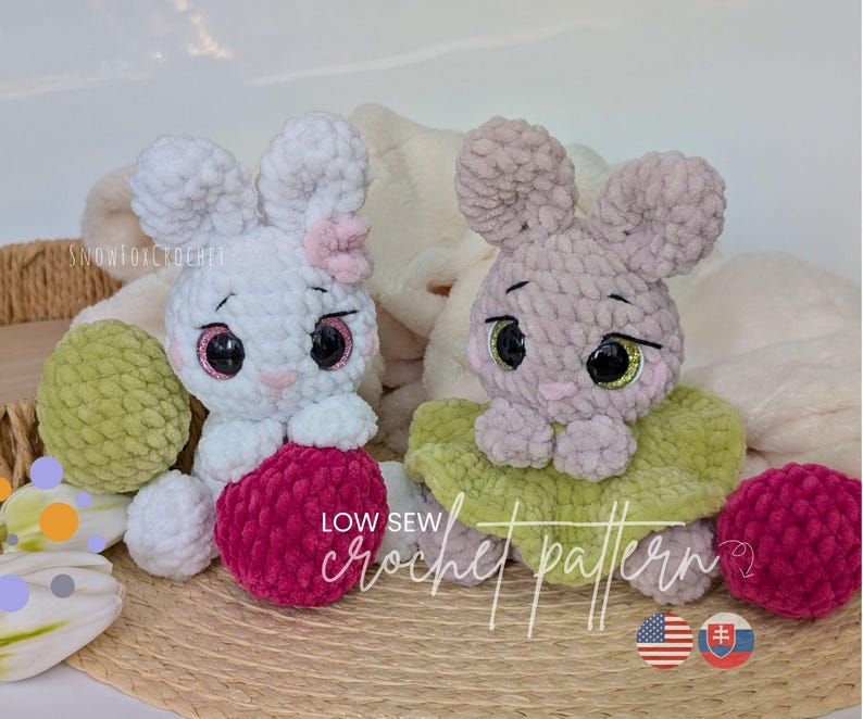 May include: Two plush crochet bunnies, one white with a pink bow and one gray, sit with decorative eggs. The bunnies have large eyes and are holding a red ball. The text "LOW SEW crochet pattern" is visible.