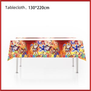 May include: A rectangular tablecloth measuring 130 by 220 cm, featuring a colorful cartoon print of jester characters and the text "HAPPY BIRTHDAY" repeated across the fabric. The design includes red curtains and various animated figures.