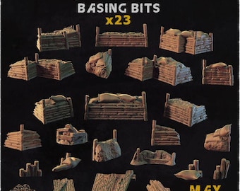 Puede incluir: Un conjunto de 23 piezas marrones en miniatura para bases de campo de batalla de trincheras, con muros de troncos, sacos de arena y escombros de madera. El texto TRENCH BATTLEFIELD BASING BITS x23, ZABAVKA WORKSHOP y MAY RELEASE aparece impreso.
