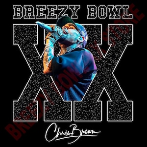 May include: Black graphic tee featuring Chris Brown performing with the text "BREEZY BOWL" in a bold, white font. The design includes a large white "X" and Chris Brown's signature. The image has a vintage, concert-style aesthetic.