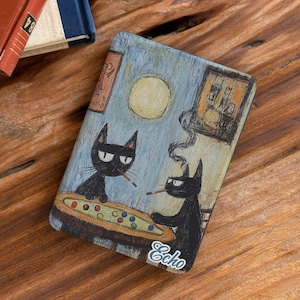May include: A rectangular case featuring a whimsical illustration of two black cats playing pool. The scene includes a full moon, a framed picture on the wall, and the word Echo written in white script at the bottom. The artwork uses textured brushstrokes.