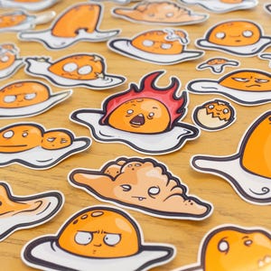 12 Waterproof vinyl egg stickers + 4 Baby Yolka bonus stickers. All yolking aside, they are eggcited to meet you!