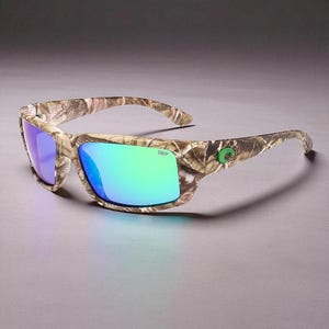 May include: Camouflage-patterned sunglasses with mirrored lenses. The frames feature a brown and tan camouflage design, and the lenses reflect shades of blue and green. The sunglasses have a green logo on the temple and the text "580P" on the lens.