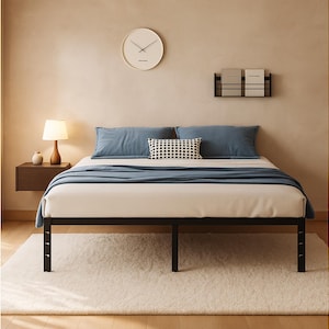 May include: A black metal bed frame with a white mattress, blue pillows, and a blue blanket. The bed is on a fluffy white rug. A round clock hangs on the wall above the bed. A small wooden side table with a lamp is on the left.