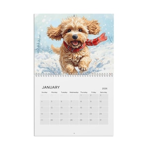 May include: A 2026 calendar featuring a playful, light brown dog wearing a red and black plaid scarf, running in the snow. The calendar page shows the month of January with the days of the week.