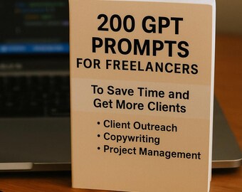 May include: A book titled "200 GPT Prompts for Freelancers" with text about saving time and getting more clients. The book is tan with black text and sits on a wooden surface next to a laptop and a black pen.