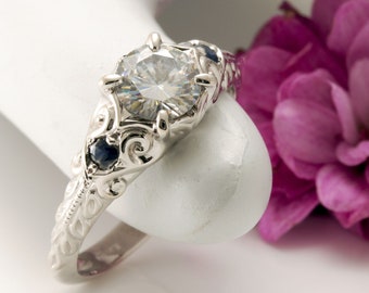 Moissanite ring, Scroll design ring, 6mm Moissanite, blue sapphire accents, sculpted,14k white gold design.